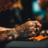 Young adult artist tattooing with creativity and skill generated by AI